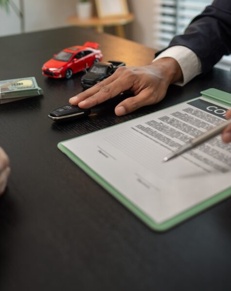 a car salesperson is explaining the details of a car purchase contract to the buyer before signing the sales contract, showroom, dealer, car contract, sining a car purchase contract a car salesperson is explaining the details of a car purchase contract to the buyer before signing the sales contract, showroom, dealer, car contract, sining a car purchase contract