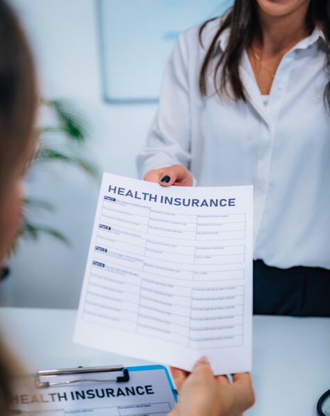 Health Insurance Claim Form Health Insurance Concept. Woman Examining her Contract.