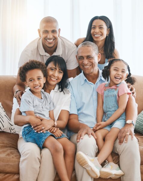portrait-happy-and-big-family-in-home-on-sofa-bo-2025-04-06-02-21-35-utc Portrait, happy and big family in home on sofa, bonding and relaxing in living room. Grandparents, .