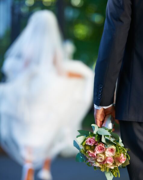 runaway-bride-cropped-shot-of-a-disheartened-groo-2025-04-06-01-11-08-utc Runaway bride. Cropped shot of a disheartened groom as his bride runs away in the distance